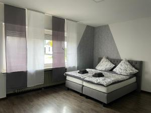 Postel nebo postele na pokoji v ubytování M&M Apartment Düsseldorf