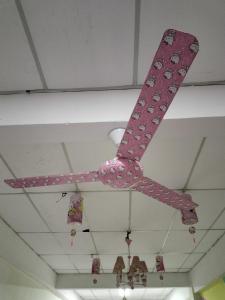 a pink controller hanging from a ceiling at Hello Kitty Homestay in Semporna