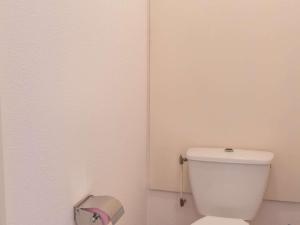 a white toilet in a bathroom with a toilet paper dispenser at Appartement lumineux 2 pièces 6 pers, proche pistes et commerces - La Salle Les Alpes - FR-1-330F-29 in Serre Chevalier