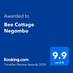 una pantalla de teléfono azul con el texto otorgado a bee cottage neogno en Bee Cottage Negombo en Negombo