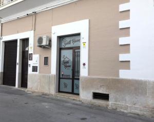 a building with a door on the side of it at Sweet Room Affittacamere in San Severo