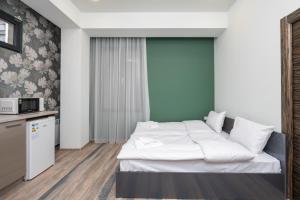 Voodi või voodid majutusasutuse Hotel Armeni toas