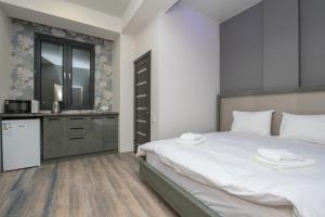 Voodi või voodid majutusasutuse Hotel Armeni toas