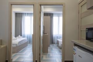 Voodi või voodid majutusasutuse Hotel Armeni toas