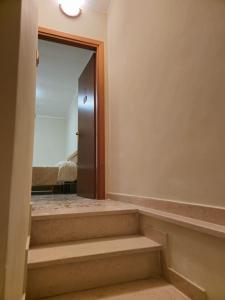 a room with stairs leading to a bedroom at ANTICA NEVIERA HOUSE in Castel di Sangro