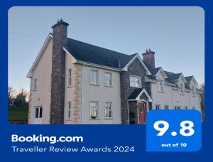 a picture of a house with the words travel review awards at Molly's Self Catering Accommodation in Cavan
