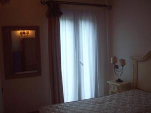 A bed or beds in a room at Villa Veronica