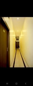 a long hallway with a bowling alley at hotel blue star in Varanasi