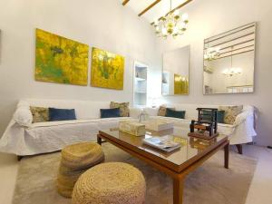 a living room with a couch and a coffee table at Aponte Suites in Seville