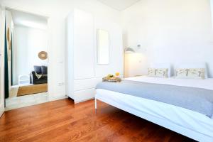 Postel nebo postele na pokoji v ubytování Lovely Faro Apartment + 4 fotografie