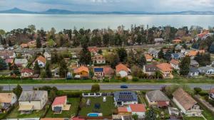 an aerial view of a town with a lake at 4seasons Apartments in Fonyód