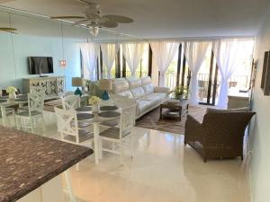 a living room with a couch and a table at Moon Bay Condo, Paradise Found in Sunny Key Largo, Florida in Key Largo