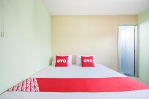 Cama o camas de una habitación en OYO 1163 Eden Hostel