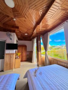 Postel nebo postele na pokoji v ubytování KHÁNH AN HOTEL