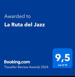 a blue sign with the text awarded to la ruta del jaza at La Ruta del Jazz in Santa Cruz