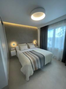 Postel nebo postele na pokoji v ubytování Ático de Lujo Izaro II Totalmente Nuevo