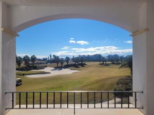 a view of a golf course from a balcony at Casa Gavendy, La Torre Golf Resort in Murcia