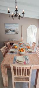 a wooden table with chairs and a dining room at Azzurra Home-Charming Property- For 6 guests in Benissa
