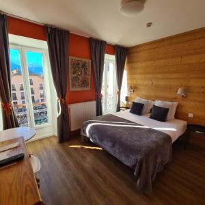 Łóżko lub łóżka w pokoju w obiekcie Le Grand Hotel