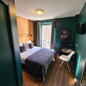 Łóżko lub łóżka w pokoju w obiekcie Le Grand Hotel