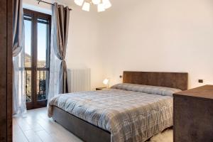 מיטה או מיטות בחדר ב-Ca ed Giuanoto