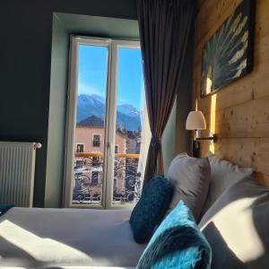Łóżko lub łóżka w pokoju w obiekcie Le Grand Hotel