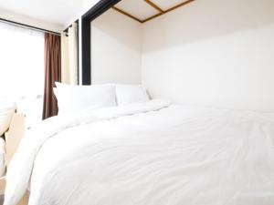 一棟貸しの宿いとんちゅ客房内的一张或多张床位