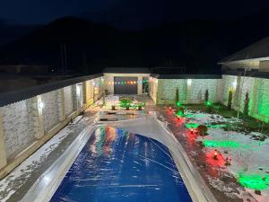 a swimming pool at night with christmas lights at Resort Villa Gabala in Gabala