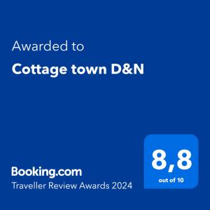 Ett certifikat, pris eller annat dokument som visas upp på Cottage town D&N