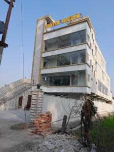 a building with a pile of bricks in front of it at Hotel Rudra in Dehradun