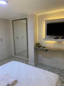 Et tv og/eller underholdning på Apartahotel Edificio Baquero x5 Apto 401