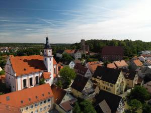 an overhead view of a town with a clock tower at Hotel Garni Pension Zur Krone in Hilpoltstein