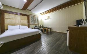 Voodi või voodid majutusasutuse Cheongju Ochang memory stay toas