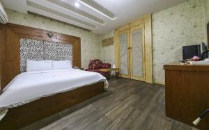 Voodi või voodid majutusasutuse Cheongju Ochang memory stay toas