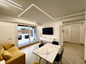 a living room with a couch and a table at Luxury Apartment Togliatti in Rome