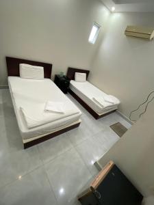 Postel nebo postele na pokoji v ubytování Phong Lan Guesthouse