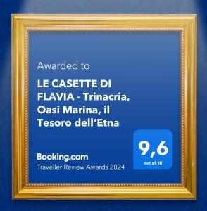 a picture of a frame with a sign in it at LE CASETTE DI FLAVIA - Trinacria, Oasi Marina, il Tesoro dell'Etna in Roccalumera