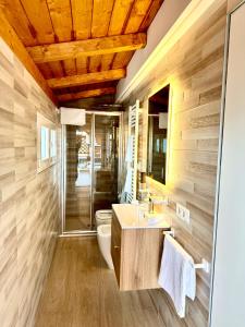 a bathroom with a toilet and a sink at Luxury Apartment Togliatti in Rome +27 photos
