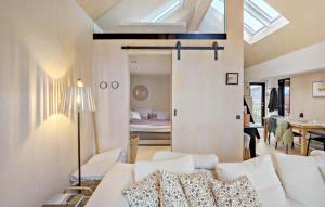 a living room with a white couch and a bedroom at 2 Bedroom Lovely Home In Vordingborg in Vordingborg +14 photos