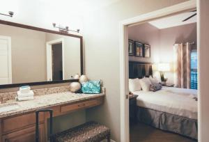 a bedroom with a bed and a large mirror at Holiday Inn Club Vacations At Orange Lake Resort, an IHG Hotel in Orlando