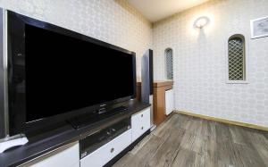 Televiisor ja/või meelelahutuskeskus majutusasutuses Cheongju Ochang memory stay