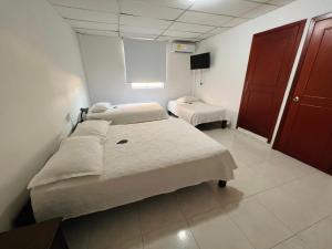 Postel nebo postele na pokoji v ubytování Hotel Dorado Plaza Centro Histórico