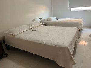 Postel nebo postele na pokoji v ubytování Hotel Dorado Plaza Centro Histórico
