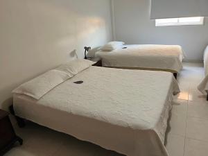 Postel nebo postele na pokoji v ubytování Hotel Dorado Plaza Centro Histórico