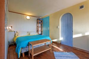 Letto o letti in una camera di Studio vue sur mer