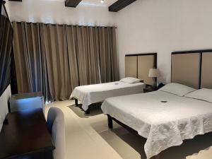 Postel nebo postele na pokoji v ubytování Hotel Dorado Plaza Centro Histórico