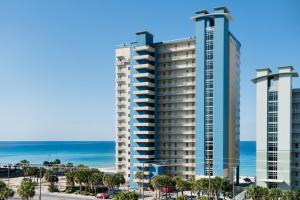 a view of two tall buildings next to the ocean at Grandview East 702 in Panama City Beach