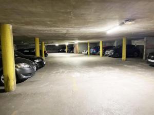 a parking garage with cars parked in it at L'Horizon - Entrée indépendante - Parking in Chartres