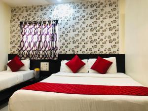 Postel nebo postele na pokoji v ubytování Hotel Guestinn Residency