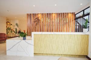 a lobby of a hotel with a reception desk at Ocotea Boutique Hotel in Monteverde Costa Rica